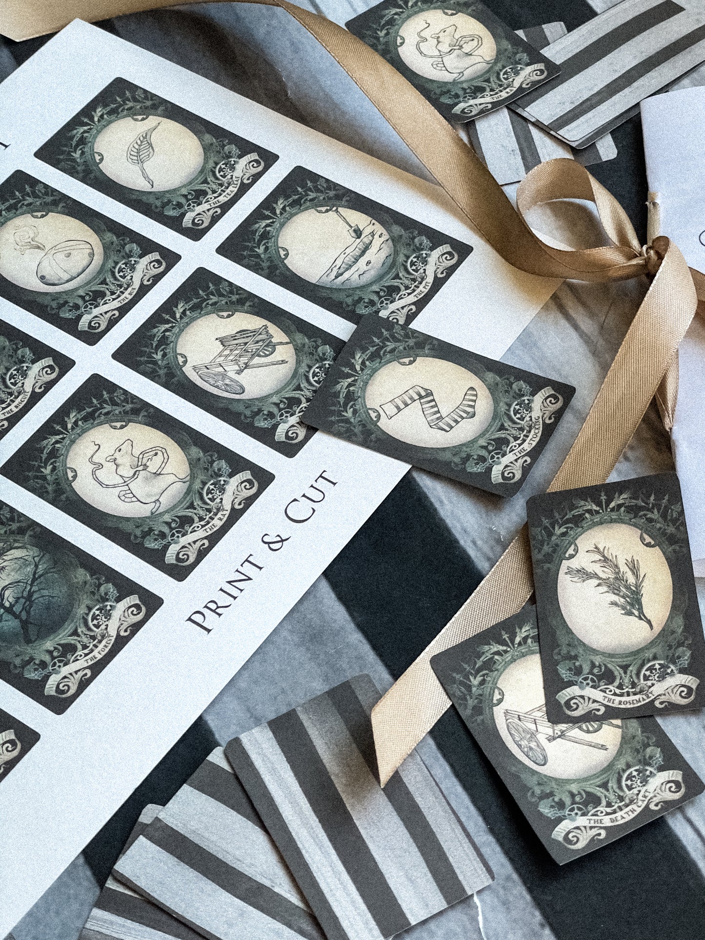 Decorative print and cut cards with intricate designs on a textured surface.