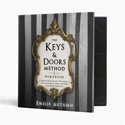 Workbook titled 'The Keys & Doors Method' by Emilie Autumn on a black and gray striped background