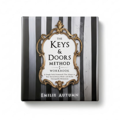 Book titled 'The Keys & Doors Method Workbook' by Emilie Autumn on a black and white striped background