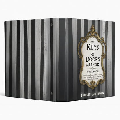 Workbook titled 'The Keys & Doors Method Workbook' by Emilie Autumn with striped design